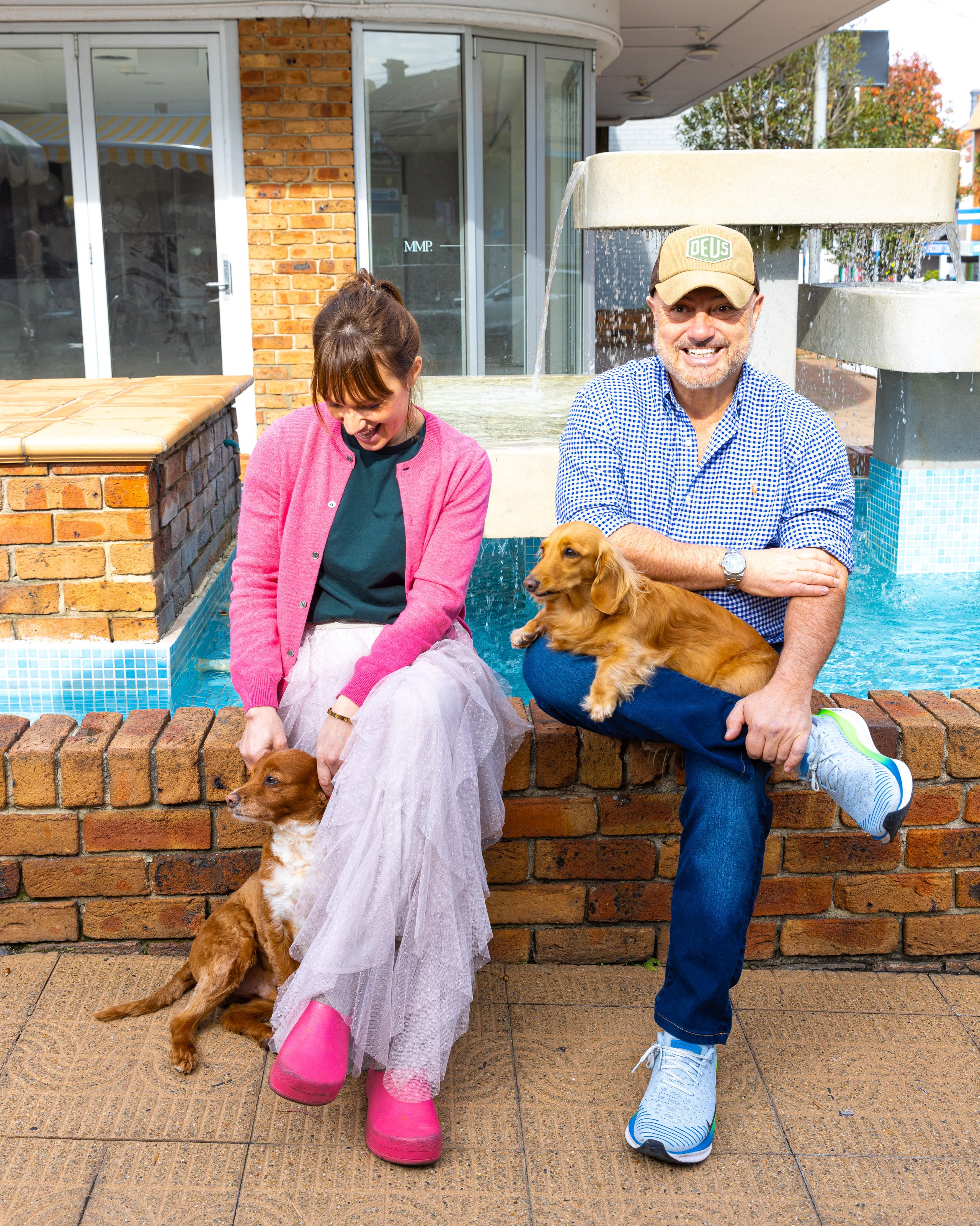 The La Bottega owners sitting outside with their dogs